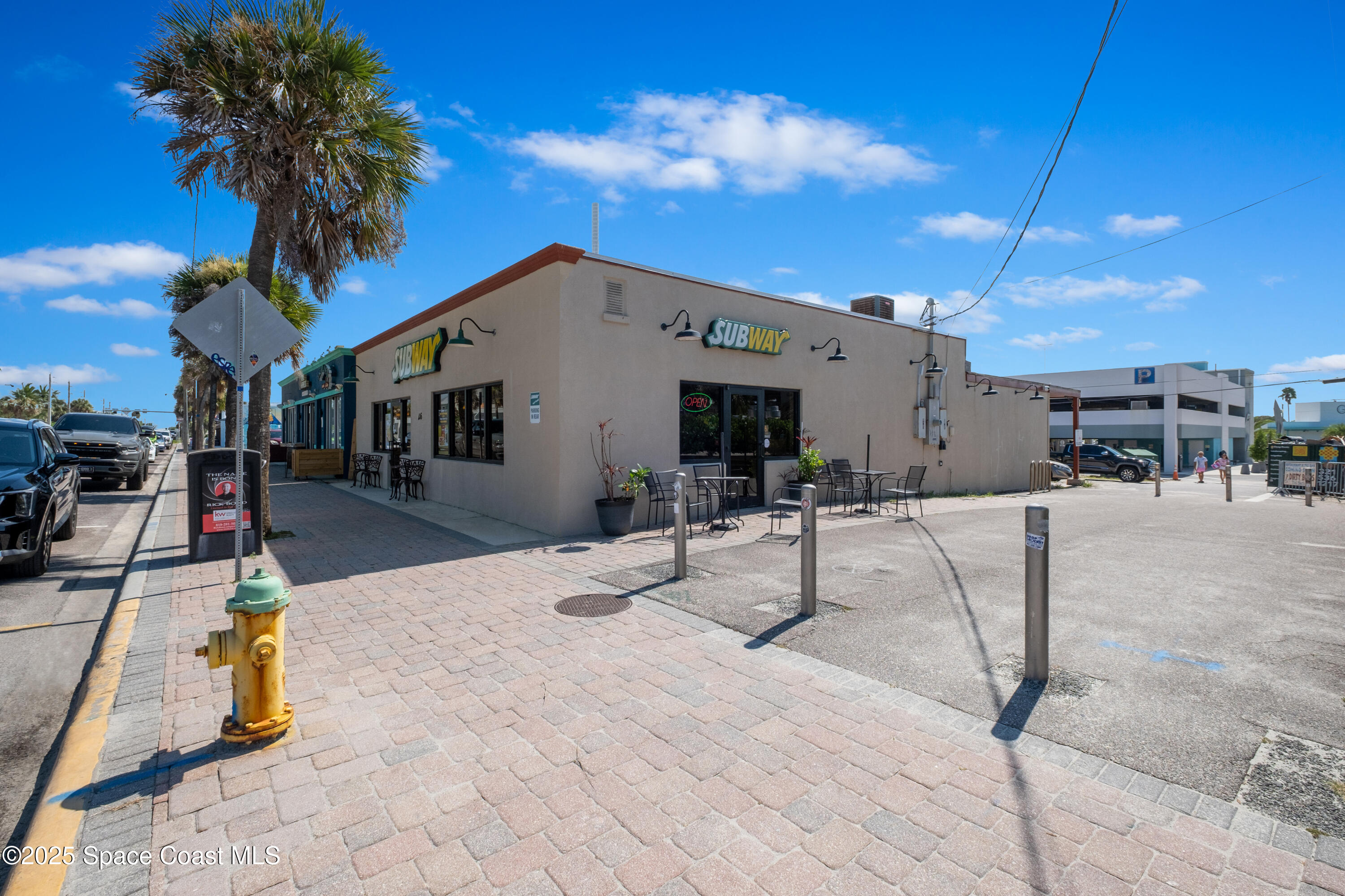 26 South Atlantic Avenue Cocoa Beach, FL 32931 - Photo 10 of 62 a view of a patio with a table and chairs