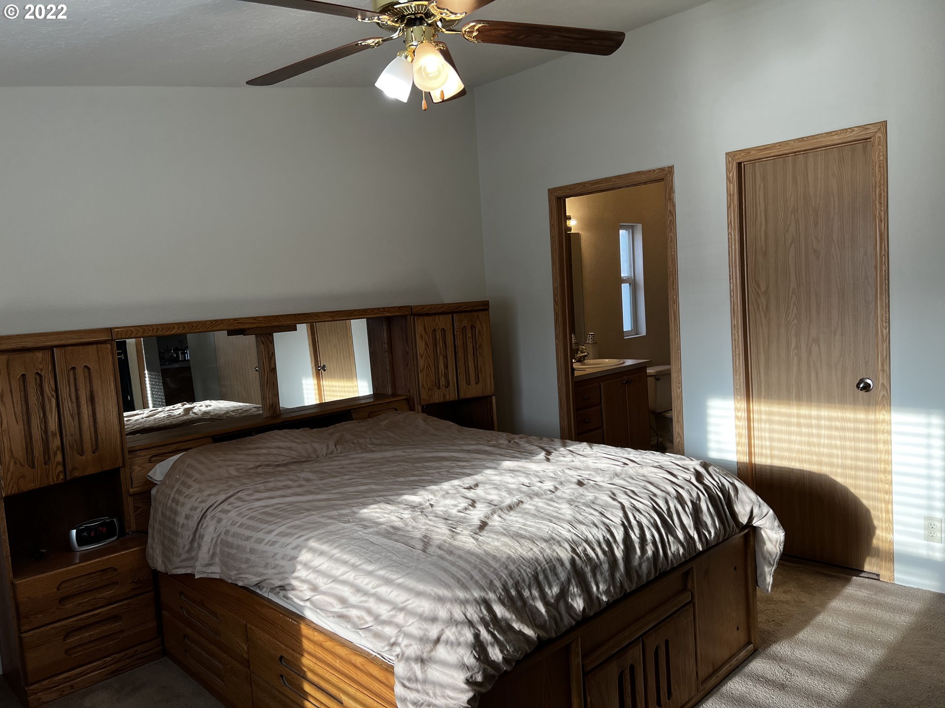 3065 Southwest Overlook Place Pendleton, OR 97801 - Photo 18 of 29 a bedroom with a large bed and a chandelier