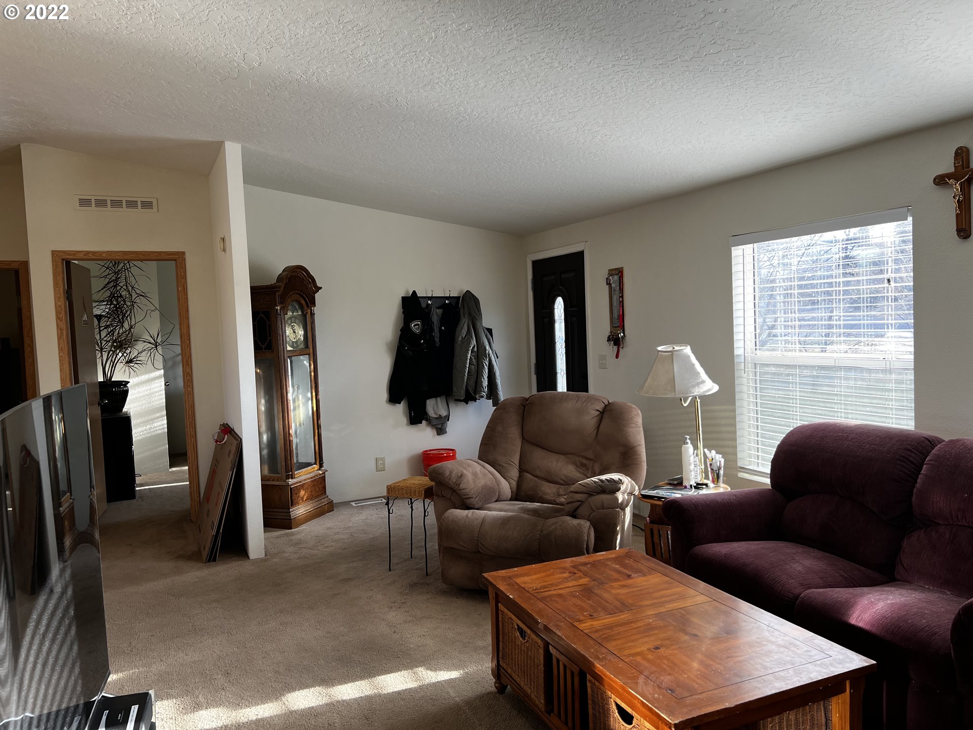 3065 Southwest Overlook Place Pendleton, OR 97801 - Photo 6 of 29 a living room with furniture a window and a flat screen tv