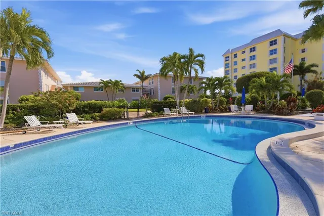 a view of a swimming pool with an outdoor seating