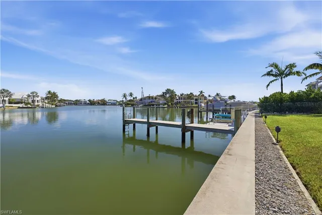 a view of a lake with a city from a balcony