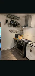 a kitchen with a stove and a microwave