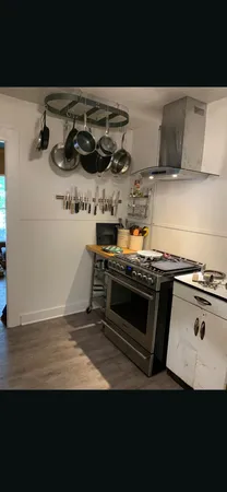 a kitchen with a stove and a microwave