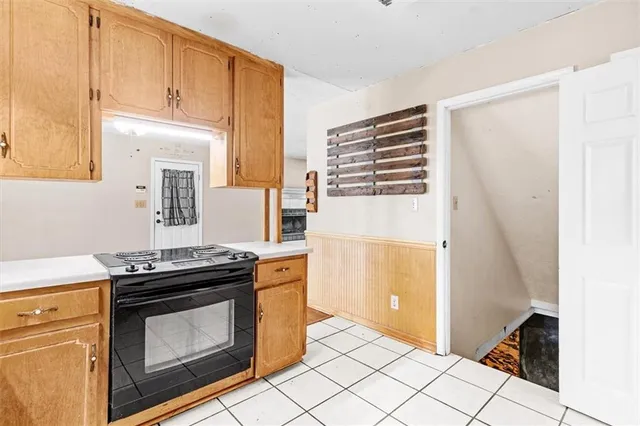 a kitchen with a stove and a microwave