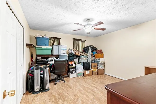 a view of a workspace with furniture and workspace