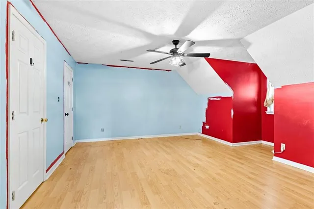 a view of a room with a bed