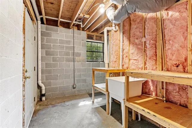 a view of a wooden chairs and table in the balcony