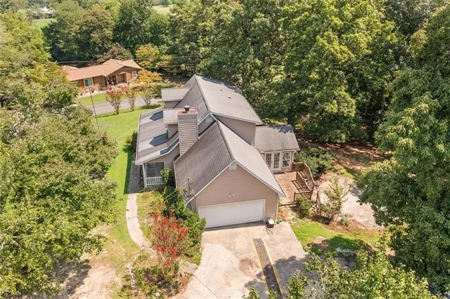 a aerial view of a house with a yard