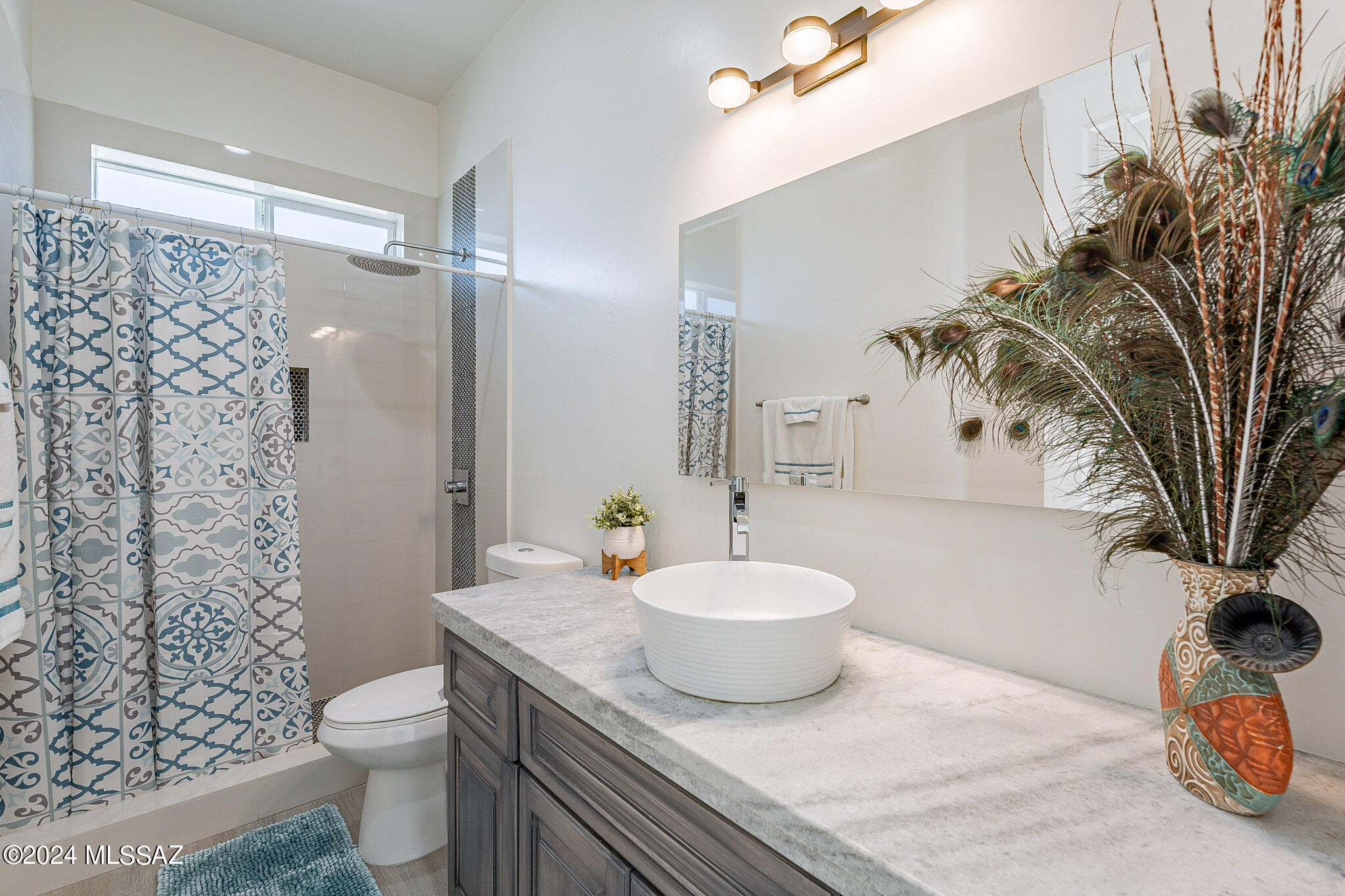 176 Avenida Ostion Rio Rico, AZ 85648 - Photo 32 of 48 a bathroom with a sink toilet and shower