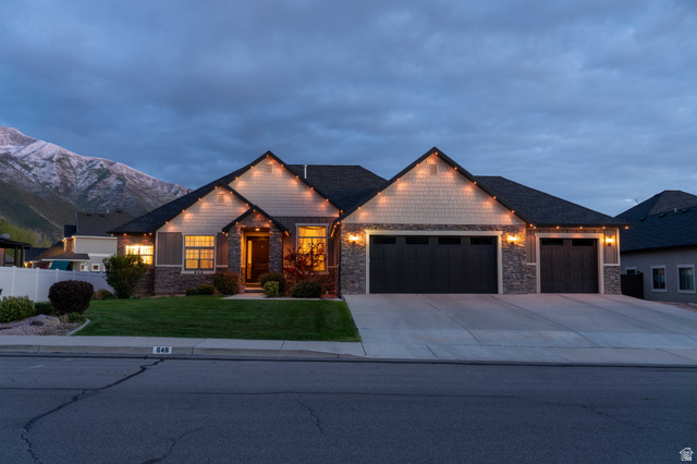 646 East 1400th Street North Mapleton, UT 84664 - Photo 6 of 78 Contemporary ranch-style residence featuring a dark asphalt shingle roof, stone and shake siding, a three-car garage, and a concrete driveway