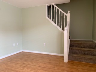 200 Post Road, Unit 312 Warwick, RI 02888 - Photo 5 of 14 Family Room - stairs to primary bedroom suite