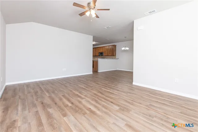 a view of a livingroom with wooden floor