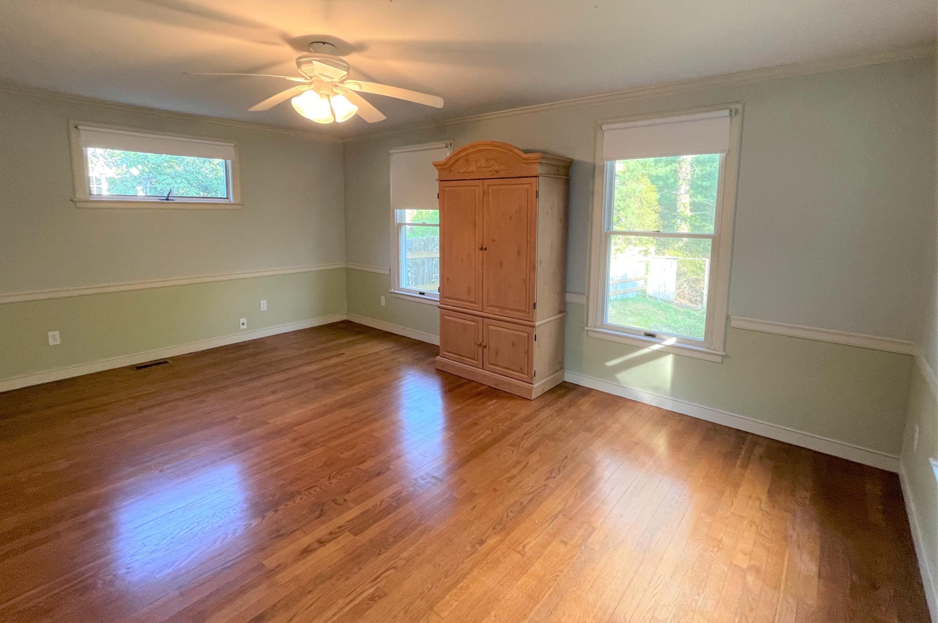 174 Tanglewood Drive Osterville, MA 02655 - Photo 11 of 34 a view of empty room with wooden floor and fan