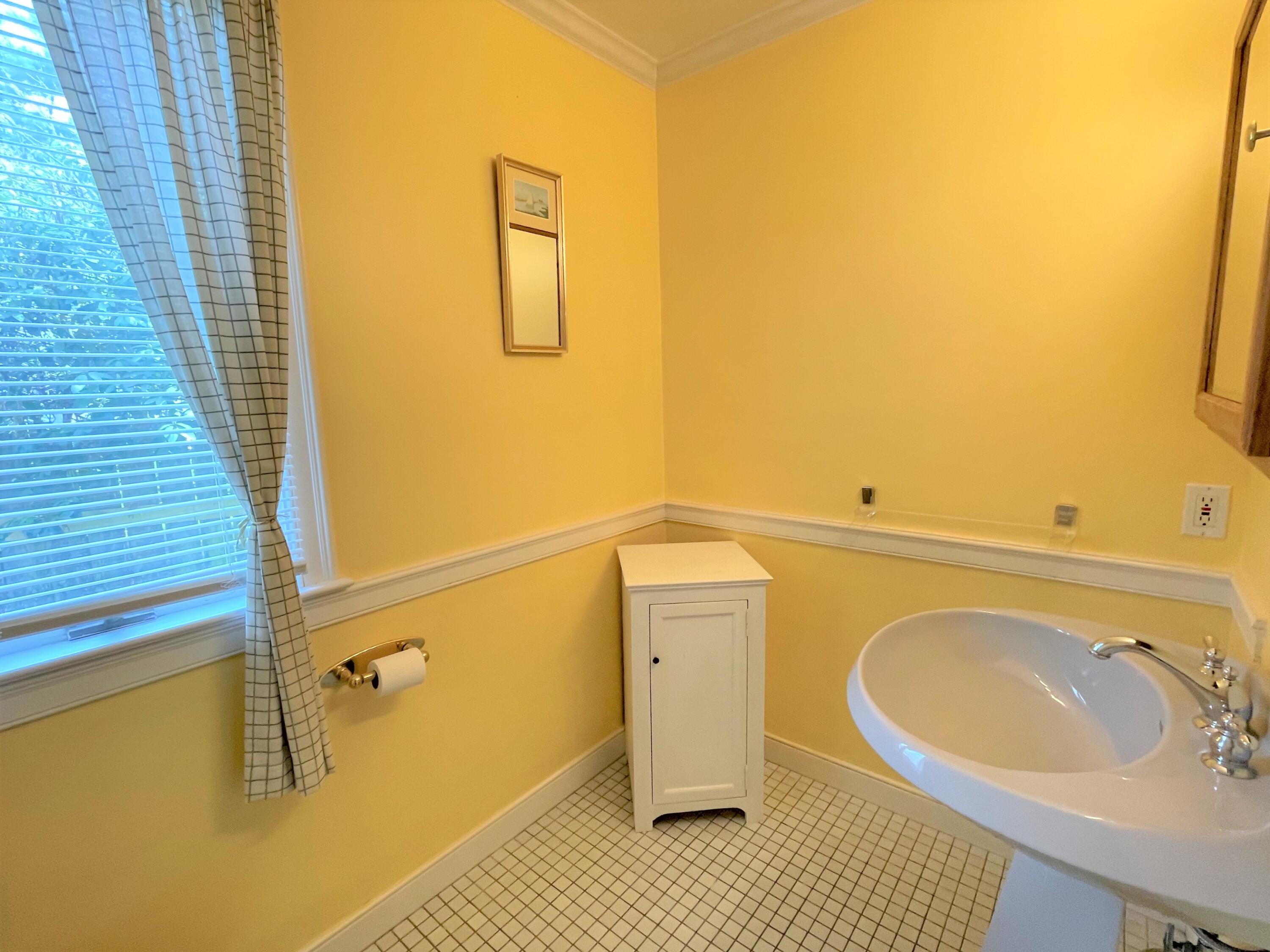 174 Tanglewood Drive Osterville, MA 02655 - Photo 13 of 34 a bathroom with a sink and a mirror