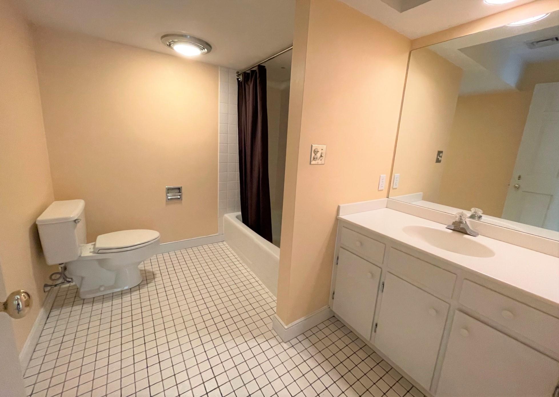 174 Tanglewood Drive Osterville, MA 02655 - Photo 24 of 34 a bathroom with a sink and a mirror