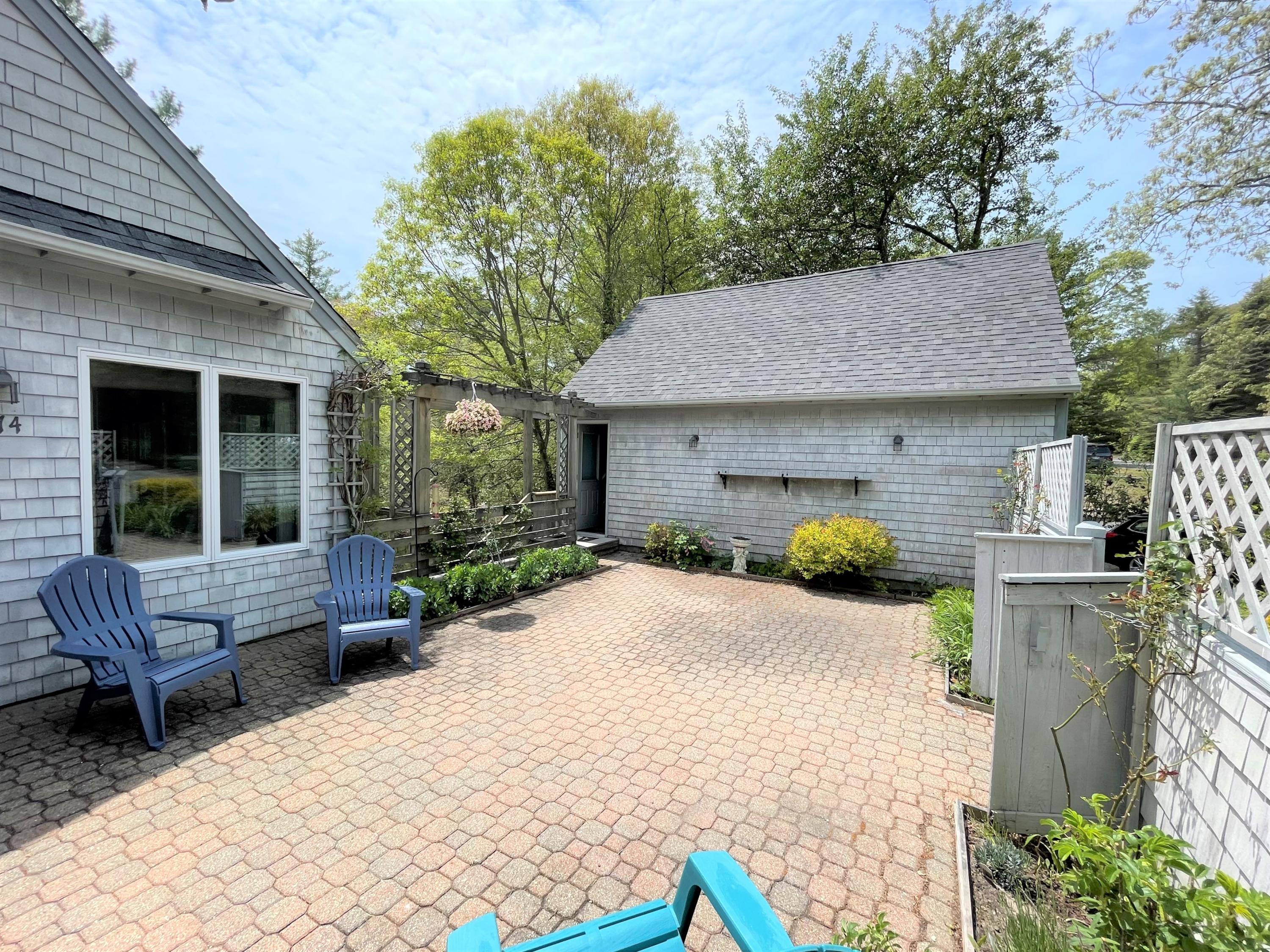 174 Tanglewood Drive Osterville, MA 02655 - Photo 5 of 34 a house view with a sitting space and garden