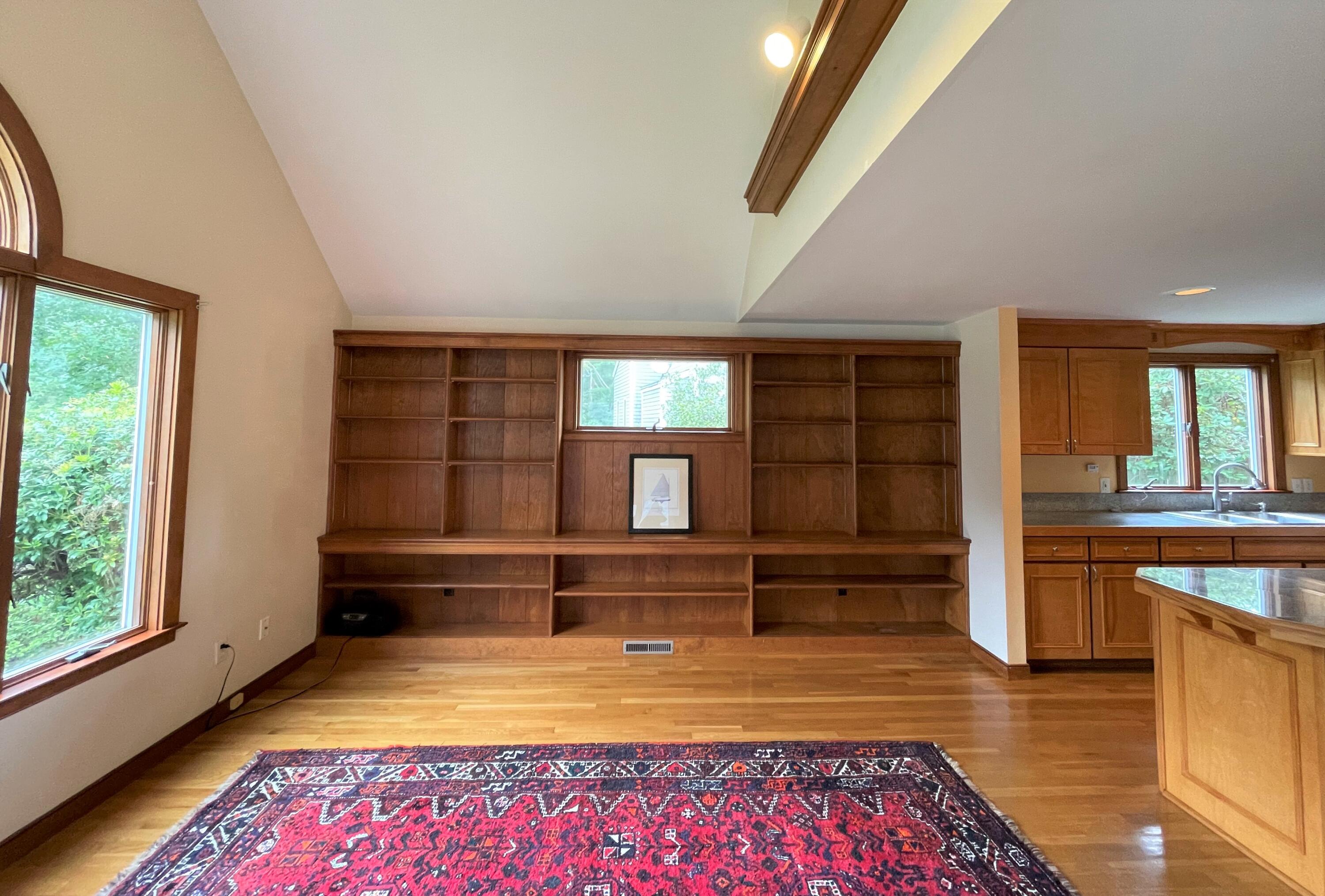 174 Tanglewood Drive Osterville, MA 02655 - Photo 7 of 34 an empty room with wooden floor and windows