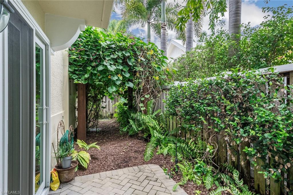 445 3rd Avenue South, Unit 102 Naples, FL 34102 - Photo 16 of 26 a view of a garden with pathway