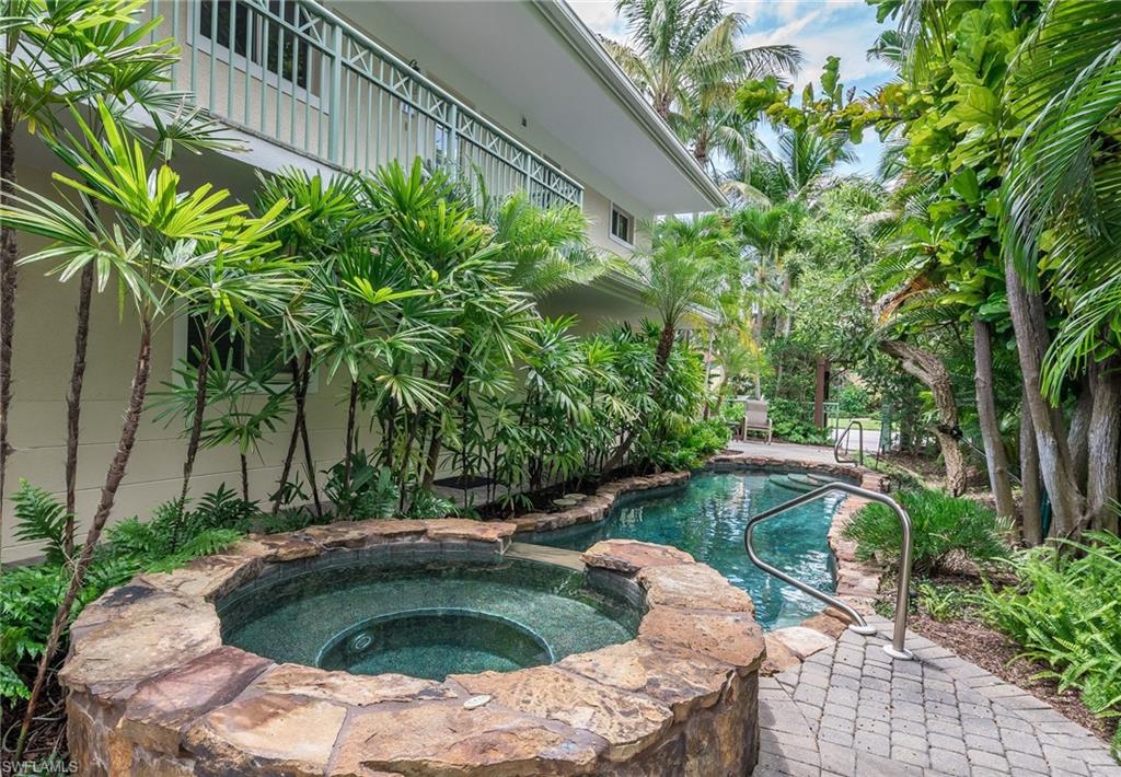 445 3rd Avenue South, Unit 102 Naples, FL 34102 - Photo 17 of 26 a view of yard with swimming pool and outdoor space