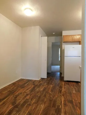 a view of a livingroom with wooden floor