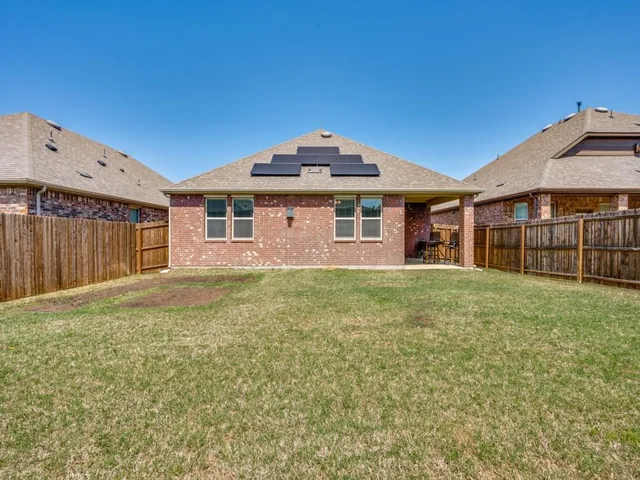 a kitchen with stainless steel appliances granite countertop a refrigerator and a stove