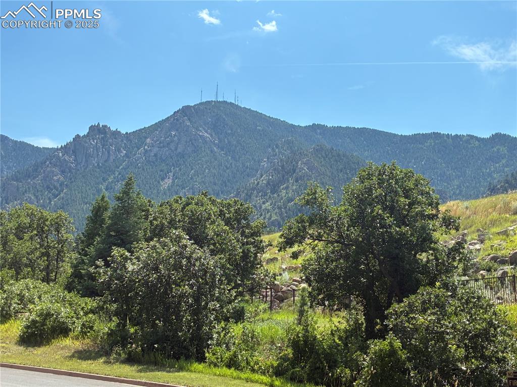 4875 Willow Stone Heights Colorado Springs, CO 80906 - Photo 7 of 8 a view of a house with a mountain in the background