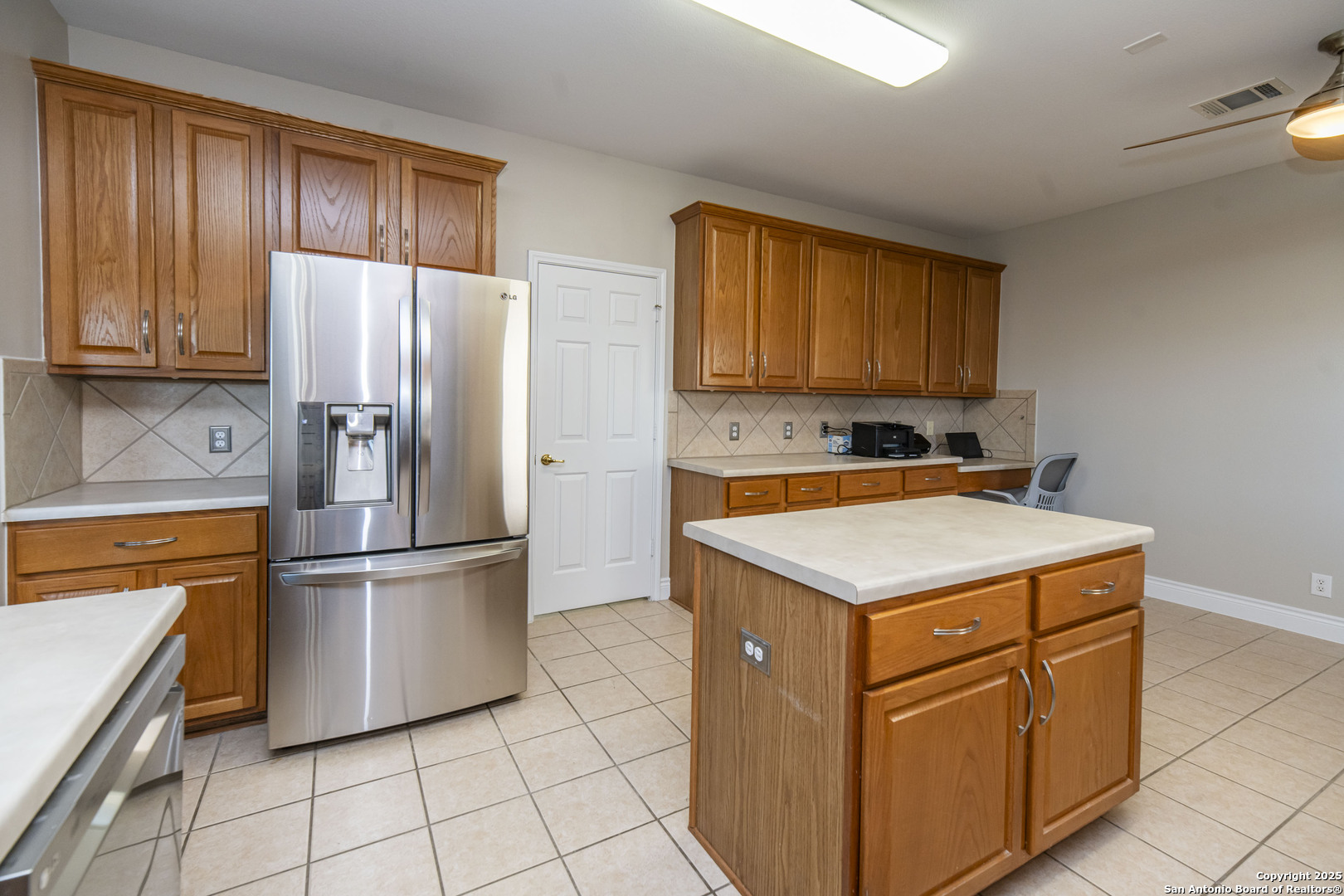 2243 Sunderidge San Antonio, TX 78260 - Photo 15 of 45 a kitchen with appliances a sink and a refrigerator