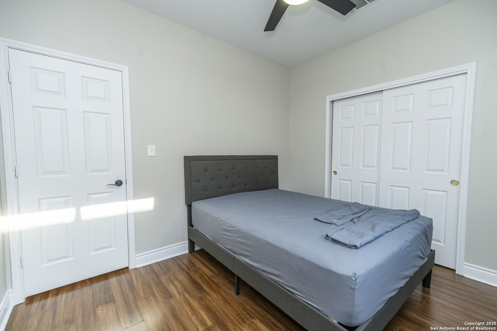 2243 Sunderidge San Antonio, TX 78260 - Photo 22 of 45 a bedroom with a bed and a ceiling fan
