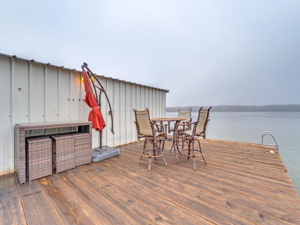 41 White Oak Road Gainesville, TX 76240 - Photo 27 of 38 a view of a dining room with furniture and wooden floor