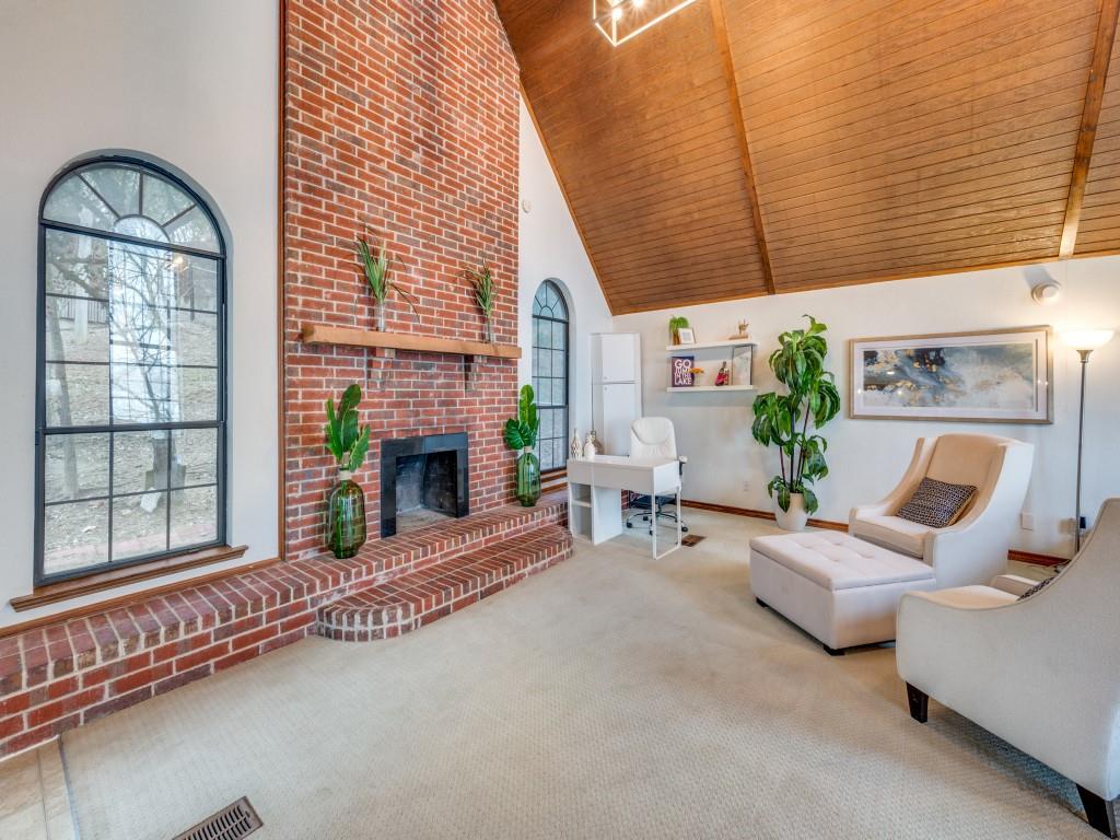 41 White Oak Road Gainesville, TX 76240 - Photo 3 of 38 a living room with furniture a fireplace and a floor to ceiling window