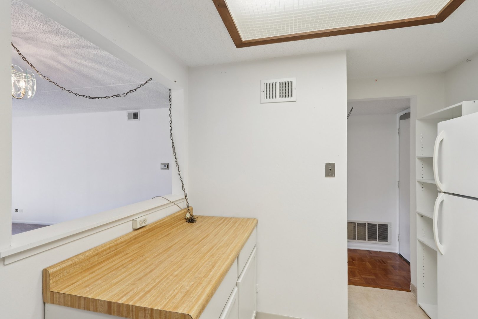 920 Vose Drive, Unit 106 Gurnee, IL 60031 - Photo 15 of 39 a room with a sink and a refrigerator