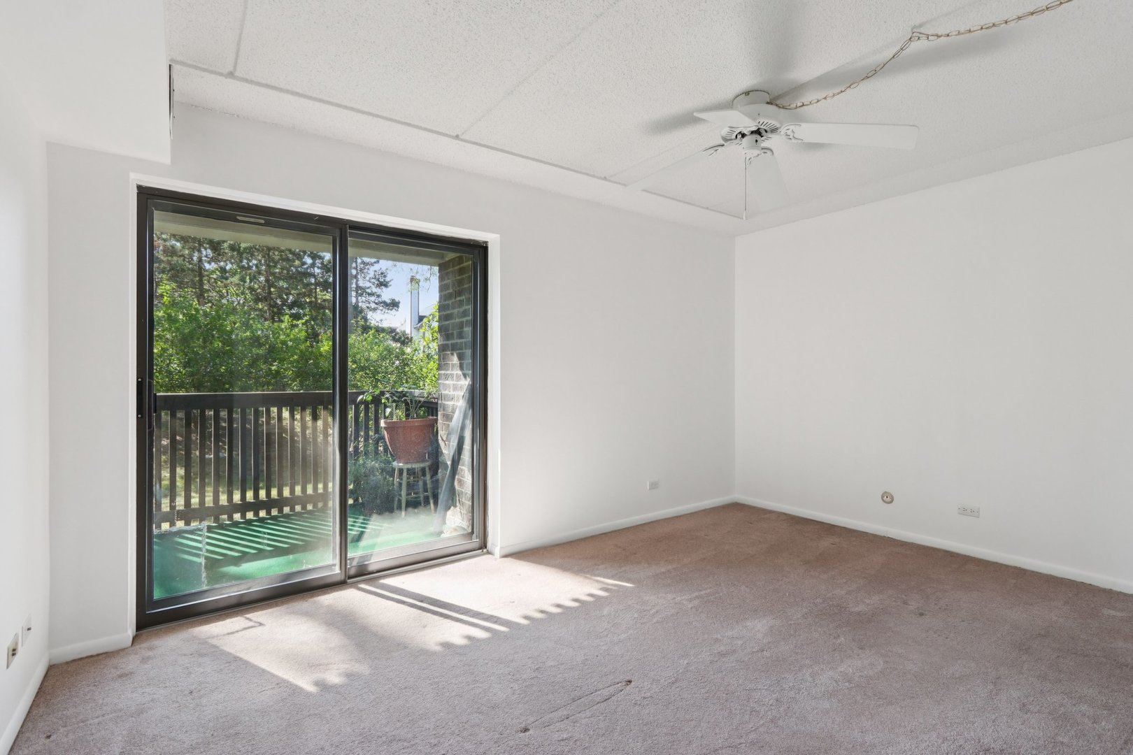 920 Vose Drive, Unit 106 Gurnee, IL 60031 - Photo 19 of 39 a view of an empty room with a window