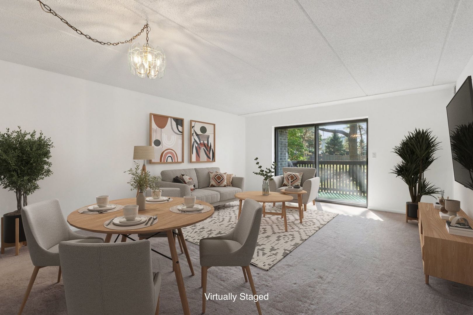 920 Vose Drive, Unit 106 Gurnee, IL 60031 - Photo 3 of 39 a view of a dining room with furniture and a potted plant