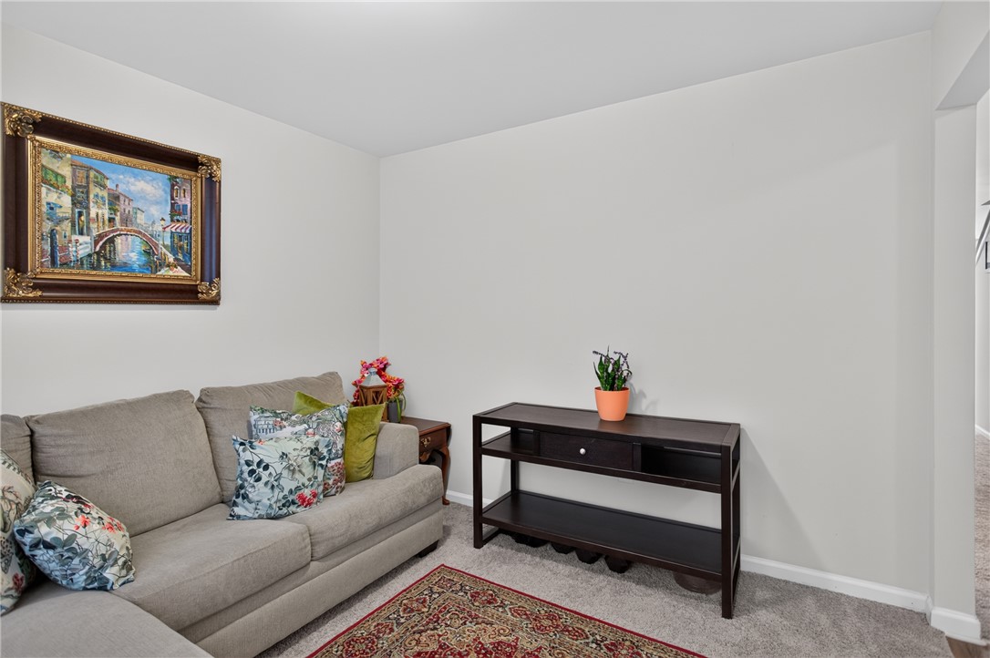 1081 Edenbrooke Circle Anderson, SC 29621 - Photo 20 of 46 A welcoming living area with soft gray carpeting and a vibrant accent rug.