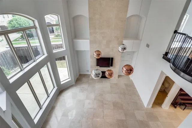 a view of living room with furniture and a large window