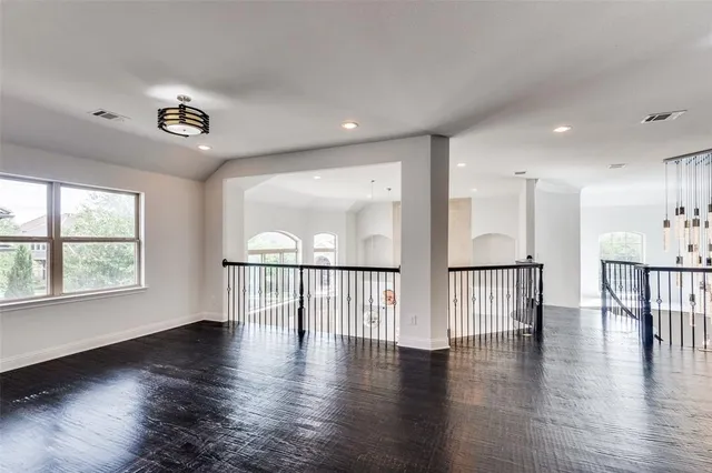 a view of an entryway with wooden floor