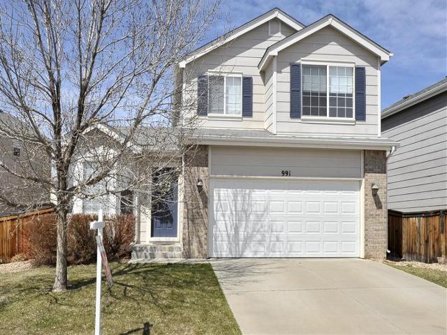 991 Timbervale Trail Highlands Ranch, CO 80129 - Photo 1 of 1 a front view of a house with a garage
