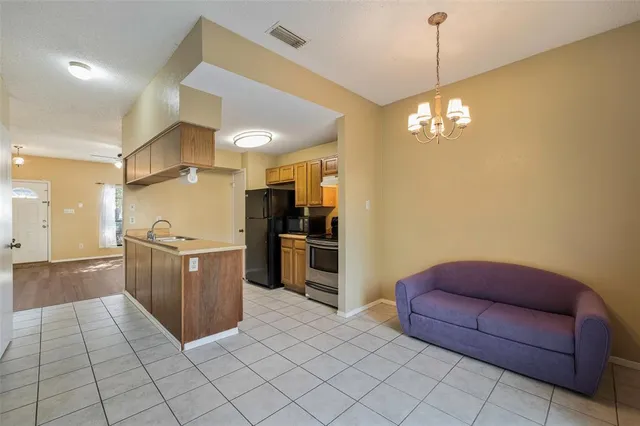 a kitchen with stainless steel appliances granite countertop a sink and cabinets