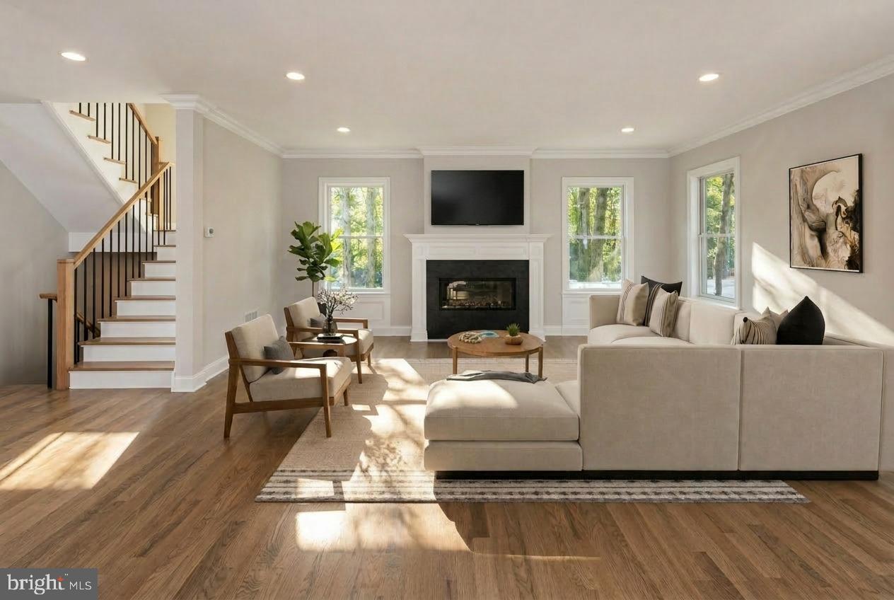 576 Ewing Street Princeton, NJ 08540 - Photo 21 of 61 a living room with furniture a fireplace and a flat screen tv