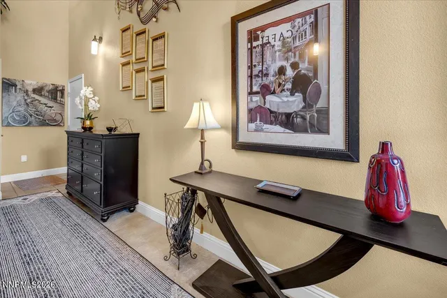 a view of a room with furniture and wooden floor