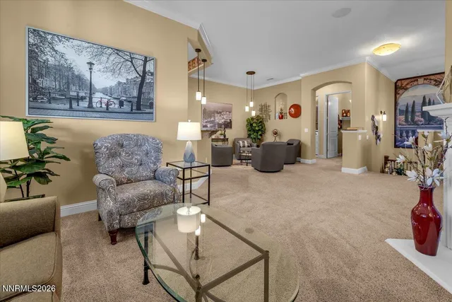 a kitchen with stainless steel appliances granite countertop a stove a sink dishwasher and cabinets with wooden floor