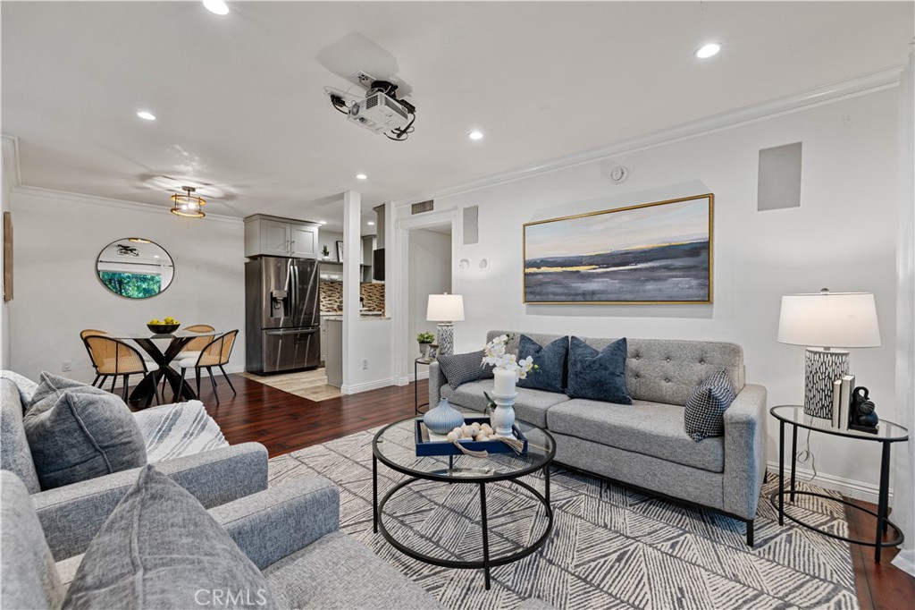 5215 Balboa Boulevard, Unit 203 Encino, CA 91316 - Photo 1 of 1 a living room with furniture and a table