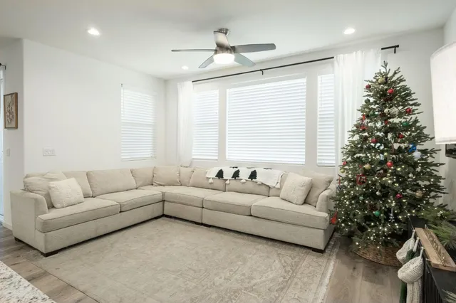 a living room with furniture and a large window