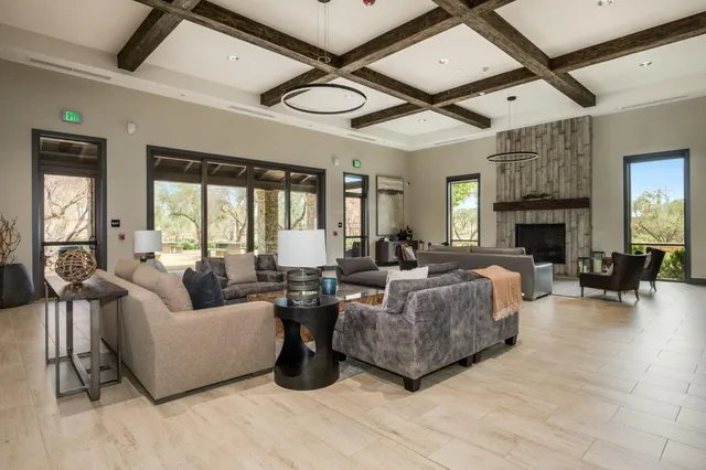 a living room with fireplace furniture and a fireplace