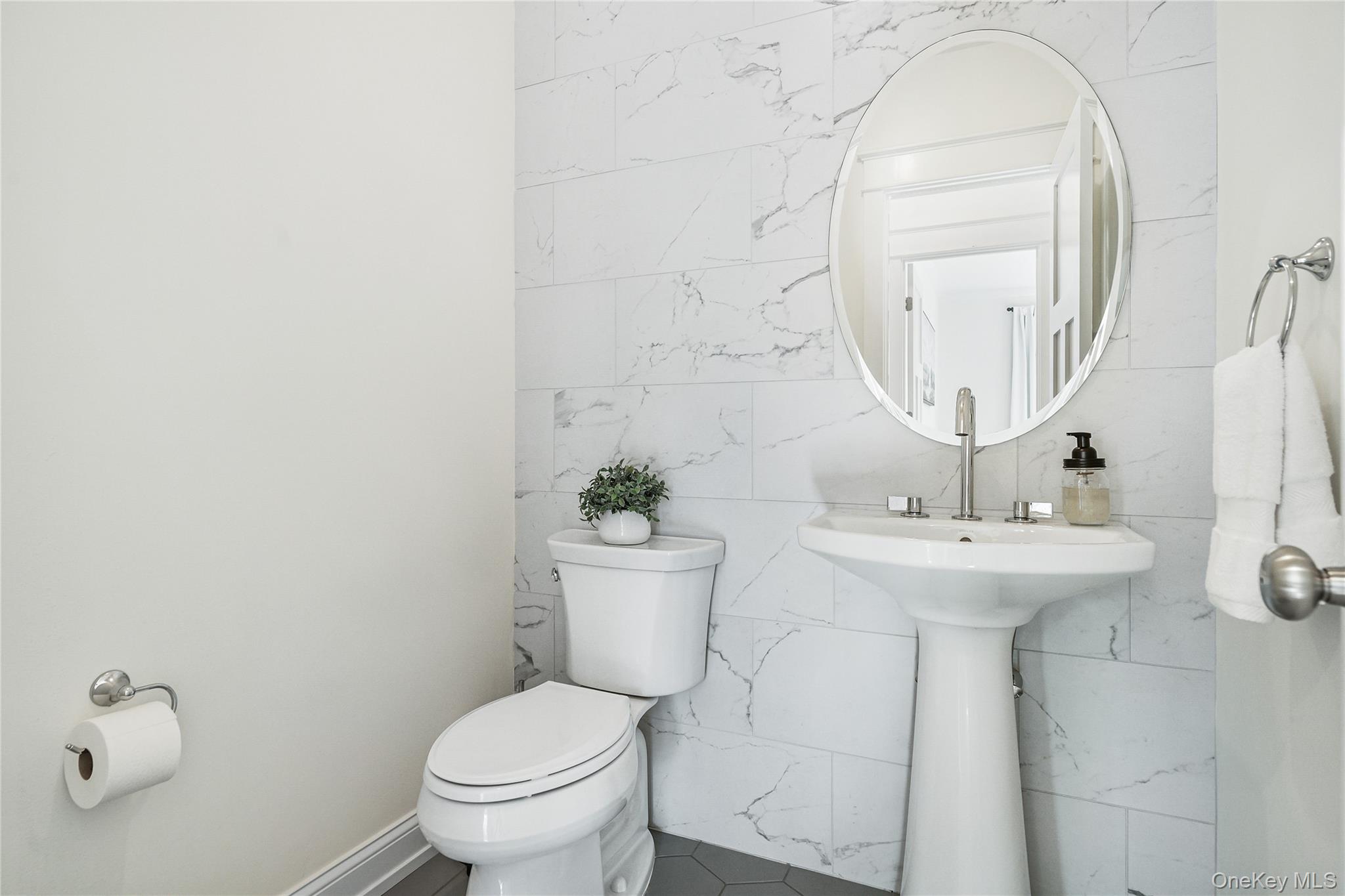 2040 Crompond Road, Unit 17 Yorktown Heights, NY 10598 - Photo 11 of 22 a bathroom with a sink a toilet and a mirror