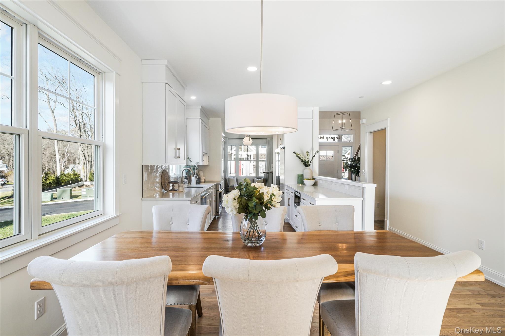 2040 Crompond Road, Unit 17 Yorktown Heights, NY 10598 - Photo 8 of 22 a view of a dining room with furniture wooden floor and chandelier
