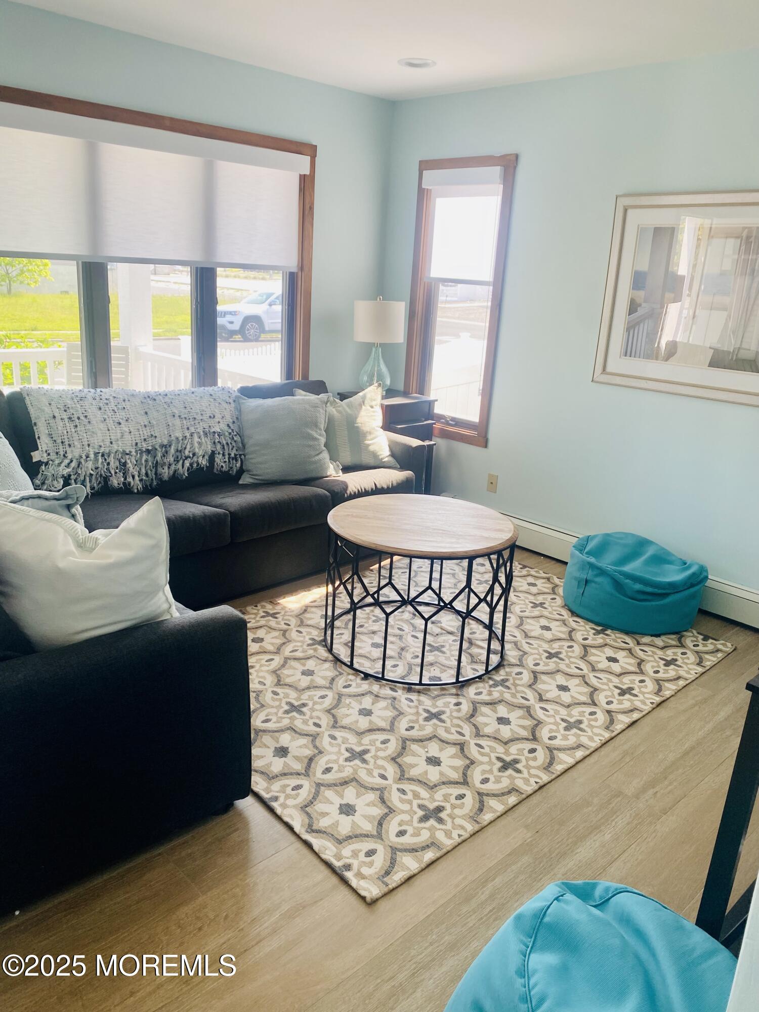 104 5th Avenue, Unit DOWN Seaside Heights, NJ 08751 - Photo 2 of 10 a living room with furniture a window and a table