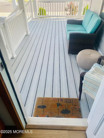 a view of balcony with furniture