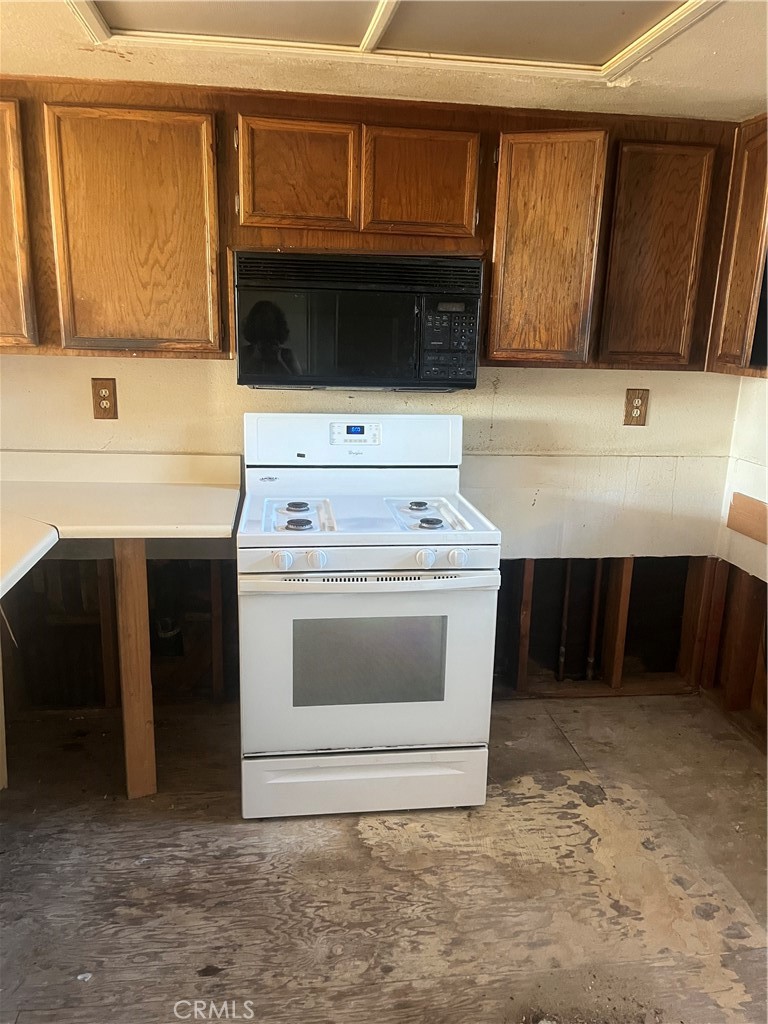 8812 Spring Canyon Drive Spring Valley, CA 91977 - Photo 11 of 22 a kitchen with a stove and a sink