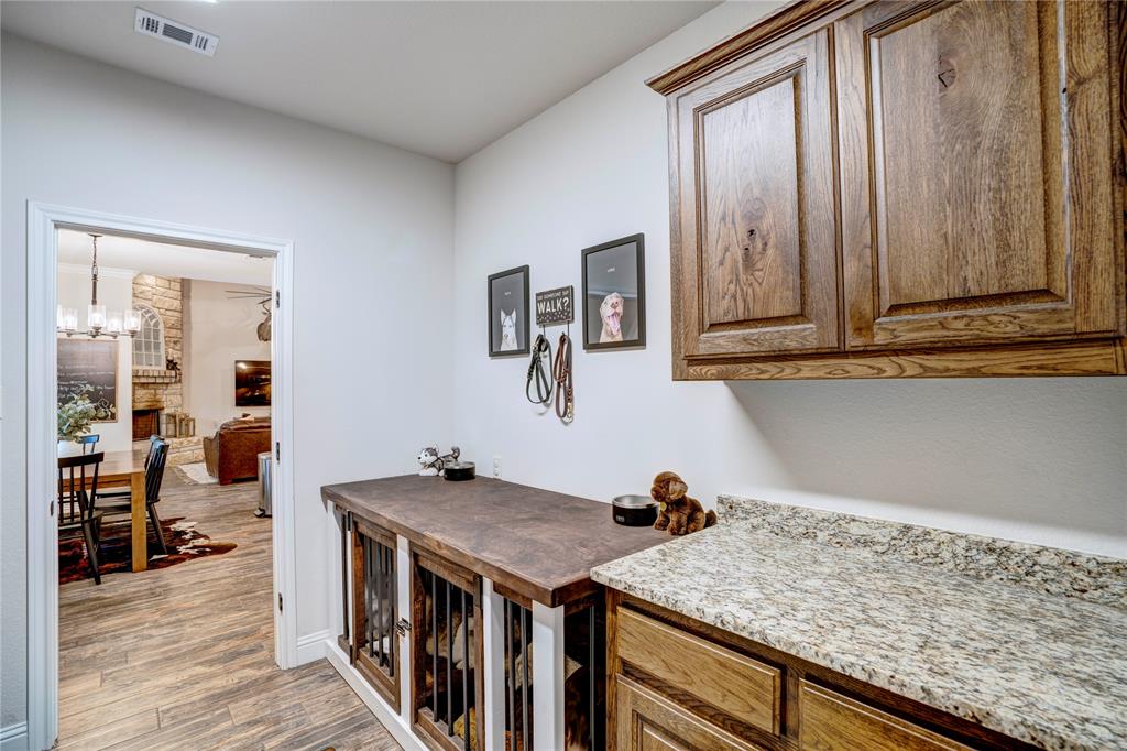 1355 Jay Bird Road Springtown, TX 76082 - Photo 23 of 40 a kitchen with a stove and cabinets